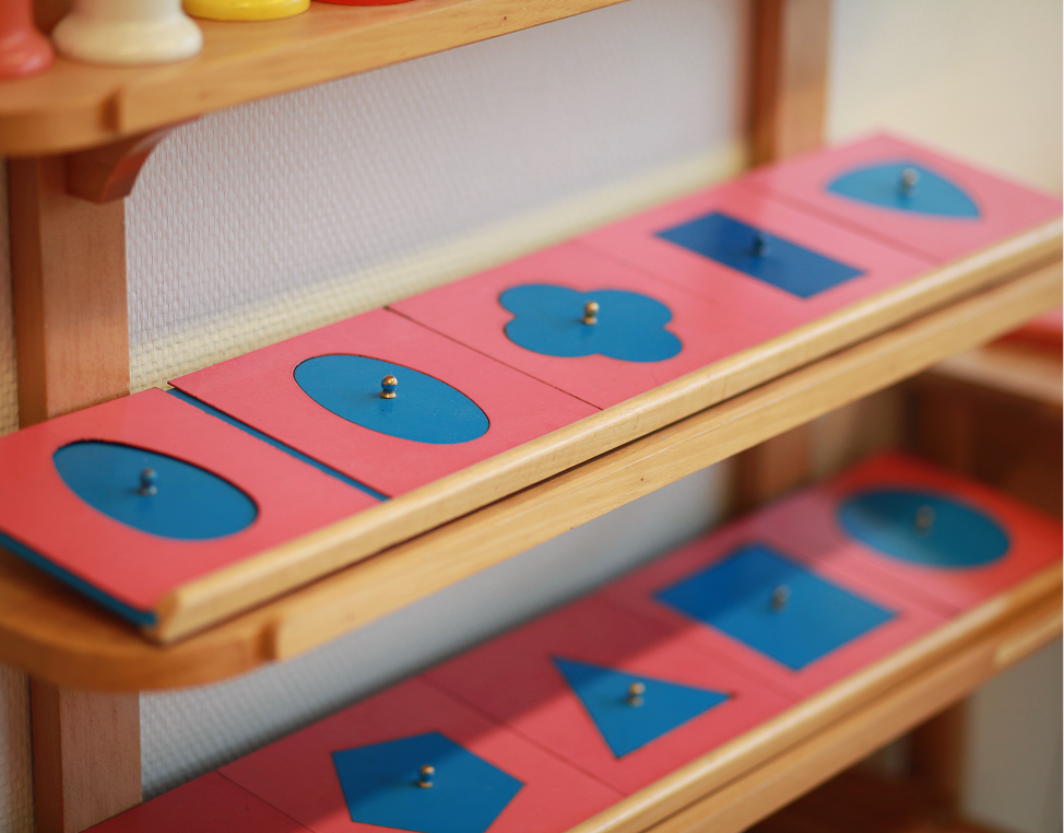 Wooden rack with shape puzzle pieces.