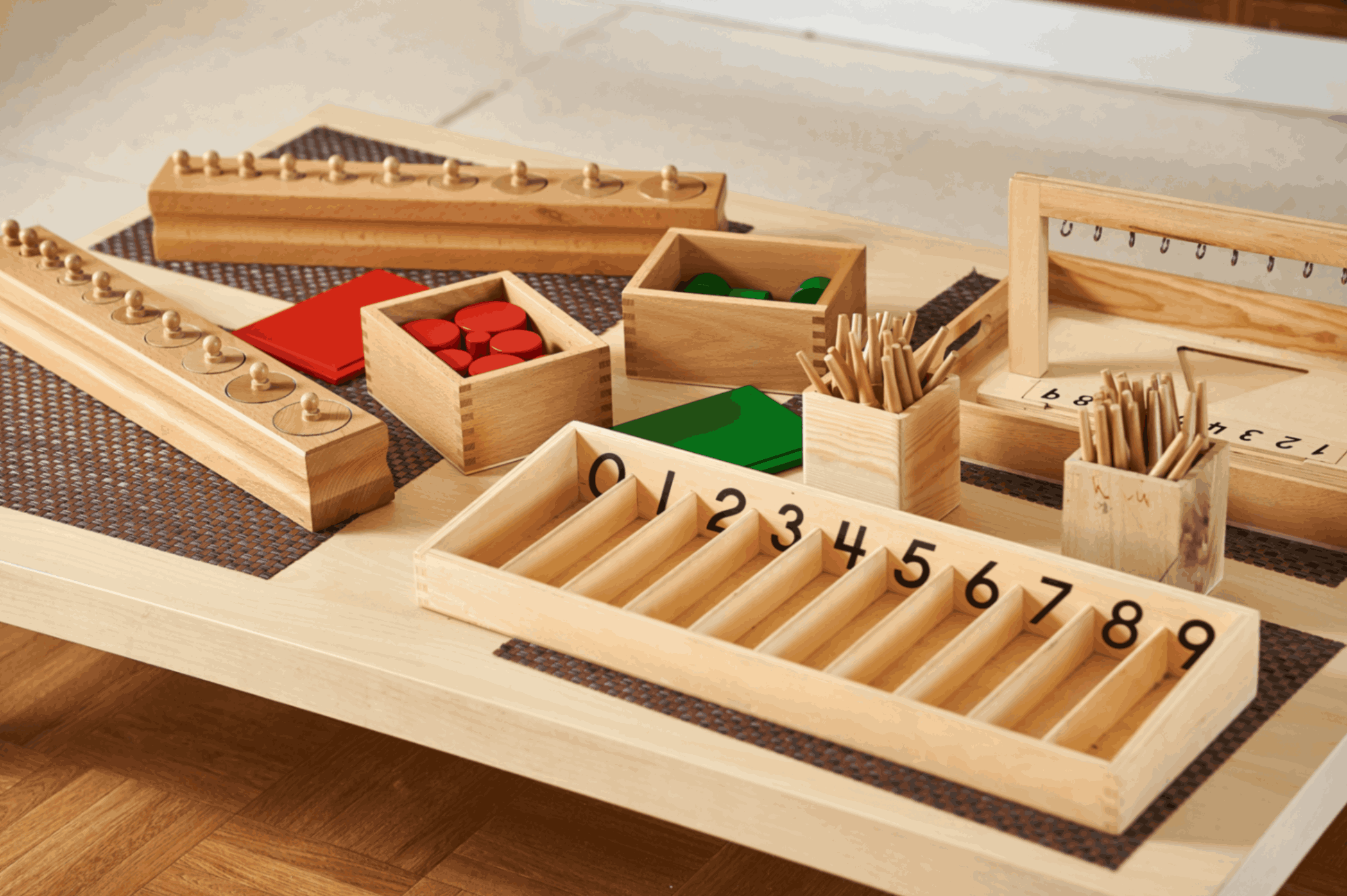 Wooden Montessori learning tools on table.